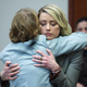 Actor Amber Heard hugs her attorney Elaine Bredehoft after she testified in the courtroom in the Fairfax County Circuit Courthouse in Fairfax, Va., Thursday, May 26, 2022.